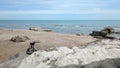 Camera on a tripod, shooting a seascape