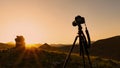 Camera on a tripod, shooting a sunset