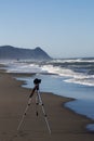 Camera on Tripod Shooting Video At Beach Royalty Free Stock Photo