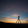 Camera on tripod in sunset Royalty Free Stock Photo