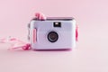 Camera waterproof toy on pink background