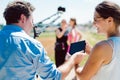 Cameraman with camera on a crane on video production set Royalty Free Stock Photo