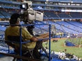 Cameraman filming a baseball match Royalty Free Stock Photo