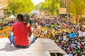 Cameraman filming Floats and fancy dress costumes at the Gauteng Carnival in Pretoria from the top of a bus Royalty Free Stock Photo