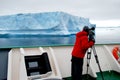 Cameraman filming a big iceberg Royalty Free Stock Photo