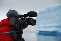 Cameraman filming an iceberg in Antarctica Royalty Free Stock Photo