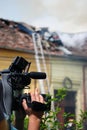 Cameraman at the fire scene Royalty Free Stock Photo