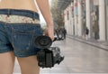 Cameraman girl holding his professional camcorder in the street Royalty Free Stock Photo