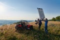 cameraman recording a young couple enjoying a buggy car ride up a mountain