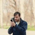 Cameraman shoots a movie camera on a trip.