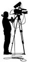 Cameraman silhouette with video camera on event,