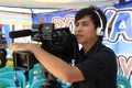 Indonesian local TV cameraman with his camera.