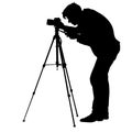 Cameraman with video camera. Silhouettes on white background. Vector illustration Royalty Free Stock Photo