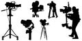 Cameraman with video camera. Silhouettes on white background. Vector illustration. Royalty Free Stock Photo