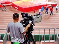 A cameraman who operates a movie camera at The 2015 IAAF World Athletics Championship in Beijing