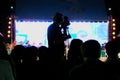 Cameraman at work, Silhouette of cameraman operator shooting a live Pong Lang performances at Bangkok, Thailand - Professional