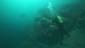 Cameramen scuba diver under water in Lake Baikal.