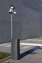 Cameras and LED floodlight for outdoor video surveillance installed near the barrier on a guarded city parking