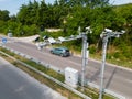 Cameras and speed control radars along a busy highway monitor and record speeding violations.