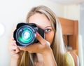 Camerawoman taking images indoor Royalty Free Stock Photo