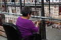 Cameron, AZ, USA: A Navajo woman demonstrates traditional rug weaving