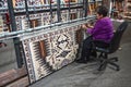 Cameron, AZ, USA: A Navajo woman demonstrates traditional rug weaving Royalty Free Stock Photo