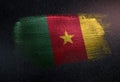 Cameroon Flag Made of Metallic Brush Paint on Grunge Dark Wall