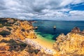 Camilo beach (Praia do Camilo) in Lagos, Algarve, Portugal. Wooden footbridge to the beach Praia do Camilo, Portugal. Picturesque Royalty Free Stock Photo