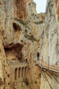 Caminito del Rey hiking trail through a deep narrow gorge. Railway viaduct.