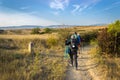 Camino de Santiago, Spain - Pilgrims Hiking through Countryside Past a Waymark Post along the Way of St James Camino de Santiago Royalty Free Stock Photo