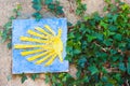 Camino de Santiago, or Way of Saint James, shell sign on the stone wall with ivy