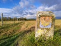 Camino Santiago de Compostela - traditional camino shell symbol on milestone Royalty Free Stock Photo