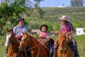 CAMINOS, CANELONES, URUGUAY, OCT 7, 2018: Gaucho family riding on horses at a Criolla Festival in Uruguay