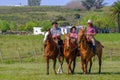 CAMINOS, CANELONES, URUGUAY, OCT 7, 2018: Gaucho family riding on horses at a Criolla Festival in Uruguay