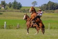 CAMINOS, CANELONES, URUGUAY, OCT 7, 2018: Gaucho riding on a wild untamed horse at a Criolla Festival in Uruguay