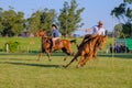 CAMINOS, CANELONES, URUGUAY, OCT 7, 2018: Gauchos riding a horse race on a track at a Criolla Festival