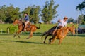 CAMINOS, CANELONES, URUGUAY, OCT 7, 2018: Gauchos riding a horse race on a track at a Criolla Festival Royalty Free Stock Photo