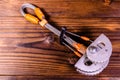 Camming device friend for rock climbing on wooden table. Top view Royalty Free Stock Photo