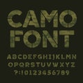 Camo alphabet font. Type letters and numbers on a dark green background. Royalty Free Stock Photo