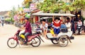 Camodian people ride tuktuk