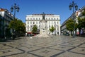 Camoes square with typical portuguese cobblestone hand-made mosaic pavement and monumental statue of 16th century epic poet Luis
