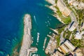 Camogli Harbor aerial view. Colorful buildings, boats and yachts moored in marina with green water Royalty Free Stock Photo