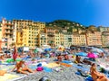 Camogli, Italy - September 15, 2019: People resting at beach at