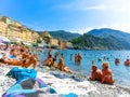 Camogli, Italy - September 15, 2019: People resting at beach at