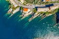 Camogli rocky coast aerial view. Boats and yachts moored near harbor with green water Royalty Free Stock Photo