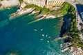 Camogli rocky coast aerial view. Boats and yachts moored near harbor with green water. Royalty Free Stock Photo