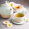 Camomille tea in handmade ceramic cup Royalty Free Stock Photo