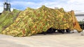 Camouflage awning for shelter of military equipment