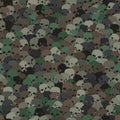 Camouflage green and brown scull silhouettes seamless pattern background