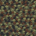 Camouflage green and brown scull silhouettes seamless pattern background